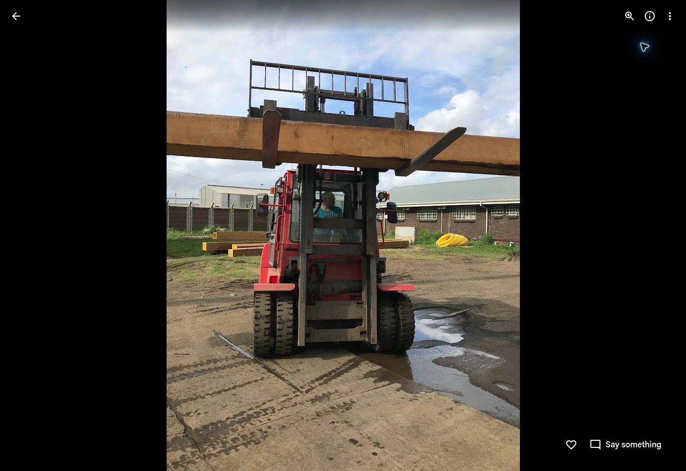 Ten-metre Greenheart timber section handled by forklift during delivery preparations
