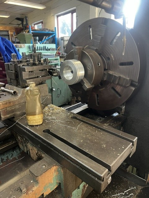 Component blank set up for turning on a lathe