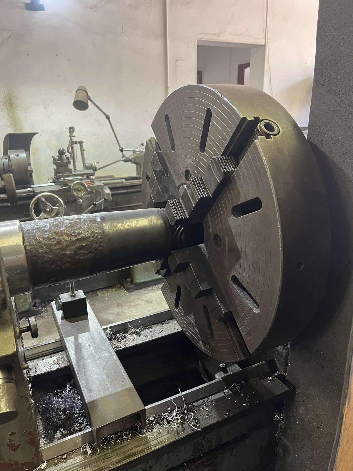 Main winch shaft taper set in a lathe for machining support
