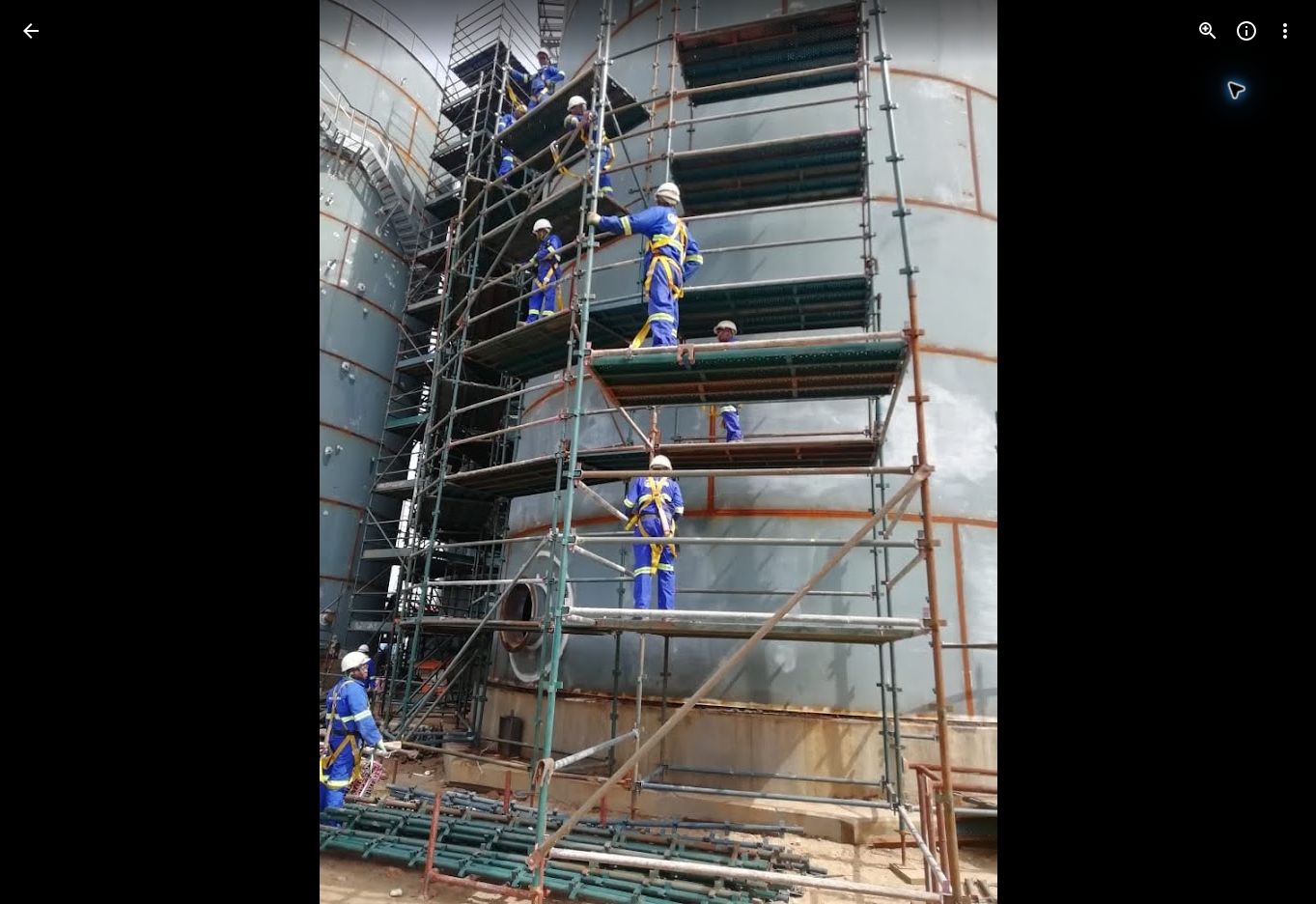 Scaffolding team working on an industrial tank structure